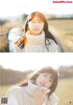 A woman in a white sweater is posing for a picture.