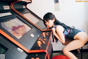 A woman sitting on top of a chair in a room.